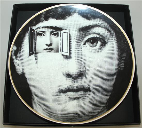 A collection of Fornasetti Temi e Variazioni and musical trophy pattern items,